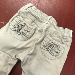 Gray jeans with ruffle pocket detail